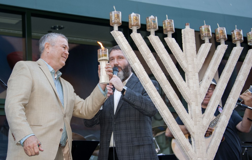 Congressman Dana Rohrabacher lit the Chanukah menorah at Fashion Island last weekend. — Photo by Charles Weinberg