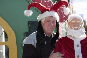 Dennis Vitarelli with Santa outside his holiday home. — Photo by Sara Hall