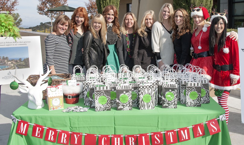 The Newport Coast MOMS pose for a group photo.