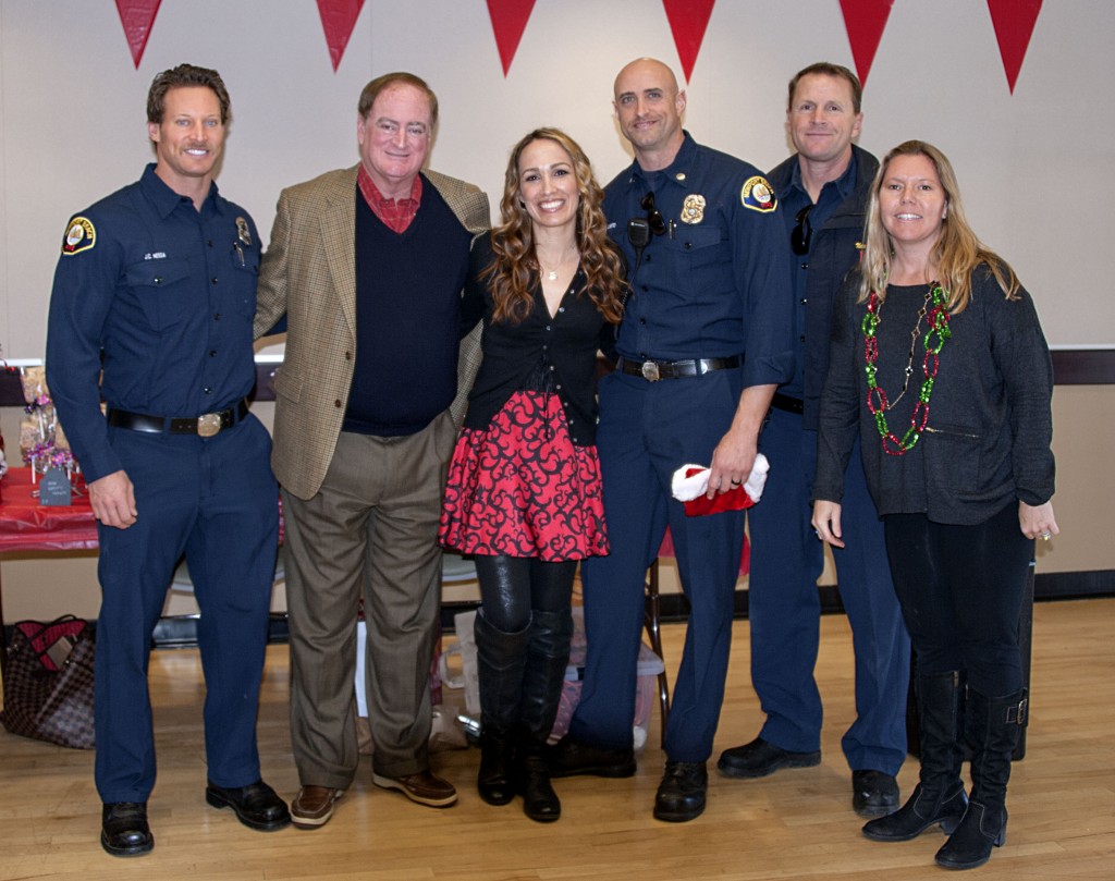 (left to right) Newport Beach Fire Department paramedic J.C. Nessa, councilman Keith Curry, MOMS carnival event chair Sherry Roshan Fredrick, fire investigator Capt. Mike Liberto, engineer Justin Kime, and MOMS member Heather Ignatin.