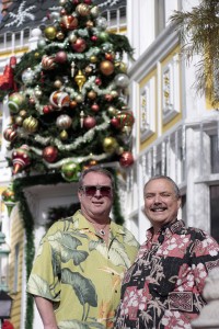 Mark Hurd (right) and Kevin Kramp outside their festive home. — Photo by Sara Hall