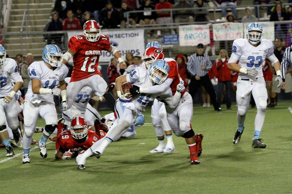 Corona del Mar High School running back Cole Martin pushes forward during the championship game against Garden Grove on Friday. CdM won 42-21. — All photos by Jim Collins