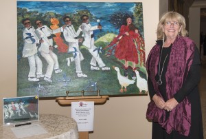 Newport Beach artist Ilona Martin with her artwork in the silent auction