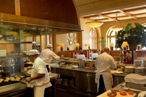 Pelican Grill Kitchen looking into dining room. Photo courtesy of Pelican Hill Resort