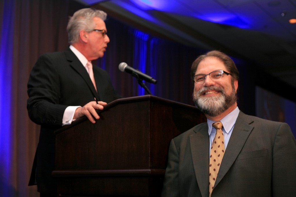 Orange County Supervisor John Moorlach "photo bombs" Master of Ceremonies for the evening, Peter Buffa.