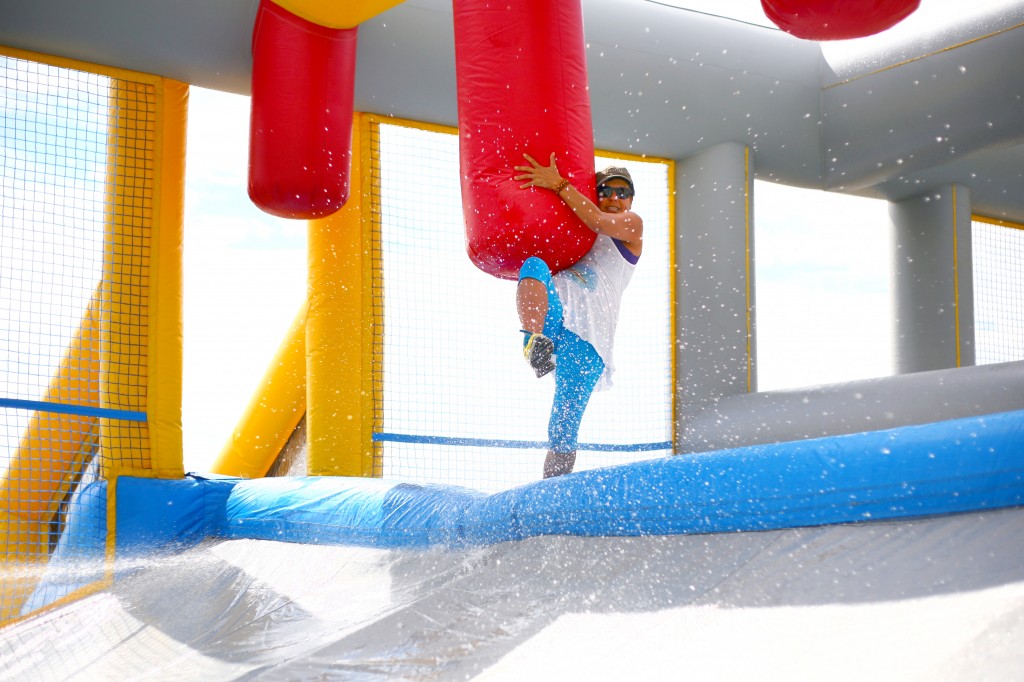 Making her way across the Slippery Slopes obstacle.