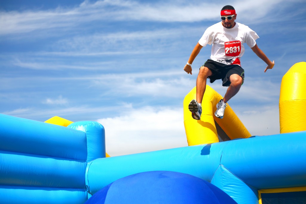 A participant jumps onto the first ball of the Bouncy Bridge obstacle. — All photos by Sara Hall