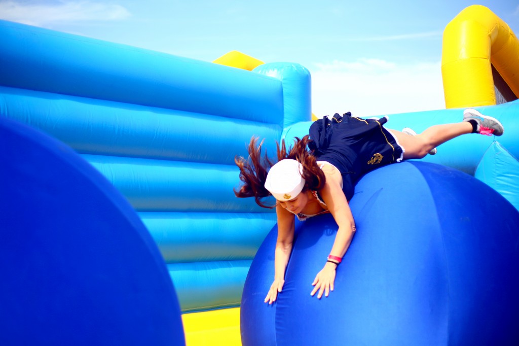 Jackie Dixon flops onto the first ball in the Bouncy Bridge obstacle.