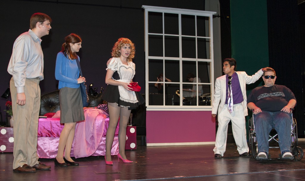 (left to right) Sophomore Austin Christensen, 16, as Harry Witherspoon, junior Scarlett Turner, 16, as Annabel Glick, senior Alexis Stary, 17, as Rita LaPorta, sophomore Henry Lopez as Luigi Gaudi and math teacher Brandon Clay as Uncle Tony perform a scene during a recent rehearsal. — All photos by Charles Weinberg