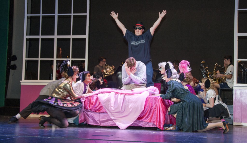 The cast, including match teacher Brandon Clay, perform a scene.