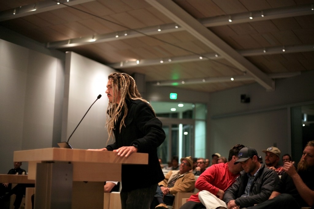 Professional skim boarder Austin Keen speaks at Tuesday night’s Parks, Beaches and Recreation meeting in support of the proposal to modify blackball regulations. — Photo by Sara Hall