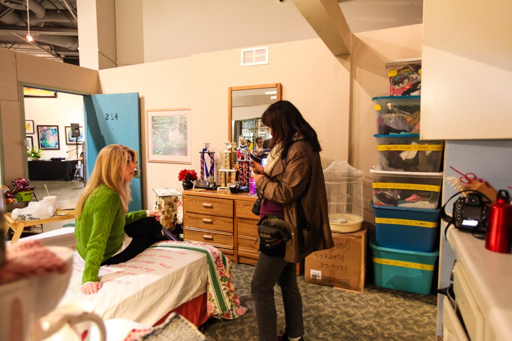 Project Hope Alliance Executive Director Jennifer Friend talks with guests inside a 214-square-foot interactive motel exhibit displayed at the "Hope for 500" kickoff event. — Photo by Shannon Vermeeren