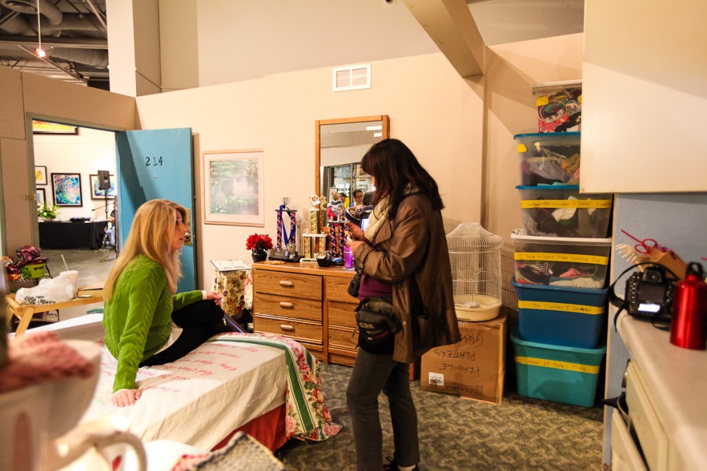 Project Hope Alliance Executive Director Jennifer Friend  talks with guests inside a 214-square-foot interactive motel exhibit displayed at the event on Sunday. — All photos by Shannon Vermeeren