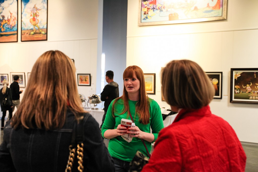 Project Hope Alliance Programs and Outreach Coordinator Susi Eckelmann talks with guests at the event.