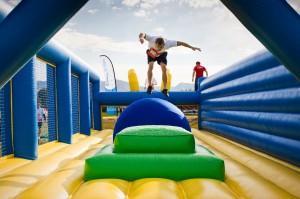 Participants make their way through an obstacle at one of last year’s Hit and Run 5K events. 