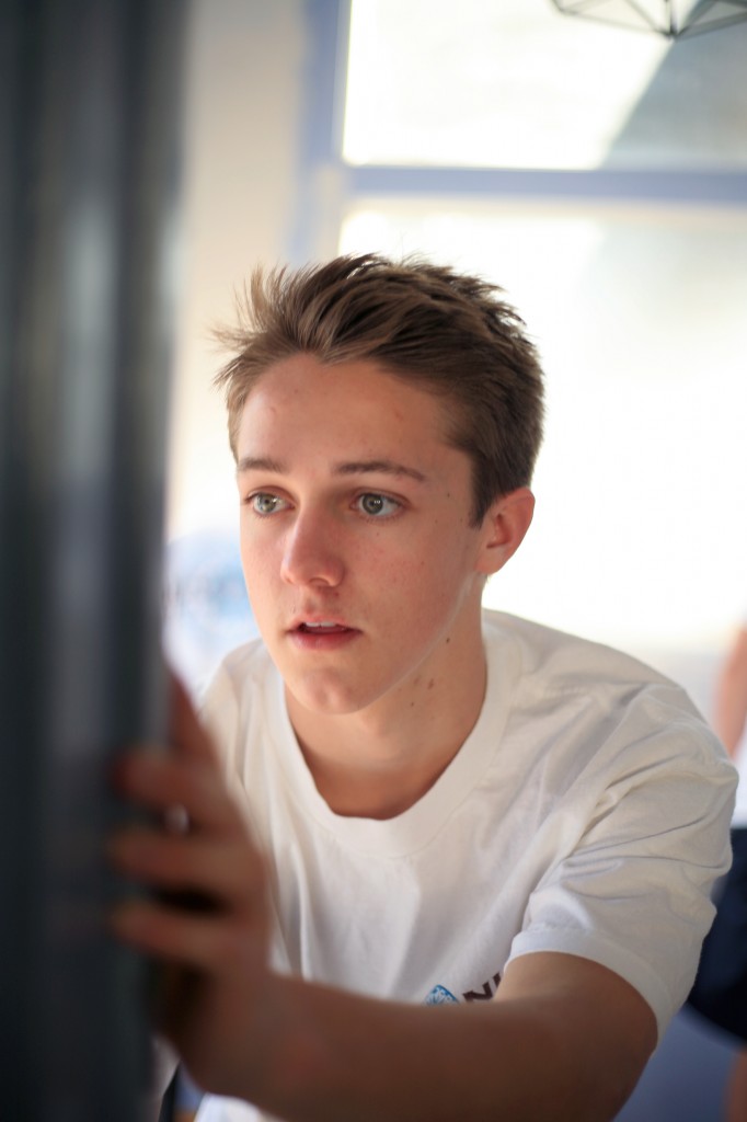 Austin Cottrell, 16, a sophomore at Corona del Mar High School, paints a room as part of the NLYM Newport Mesa chapter’s renovation of Lighthouse Church.