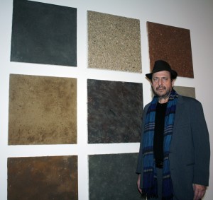 Artist Alan Sonfist, stands next to his piece, “Nine works from the series Earth Paintings of U.S.A."