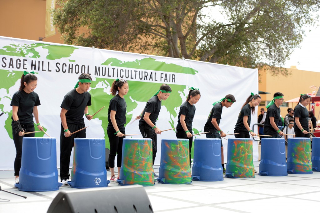 A group of Sage Hill School students perform on the Korean Nanta Drums during the school's 13th Annual Multicultural Fair on Saturday.