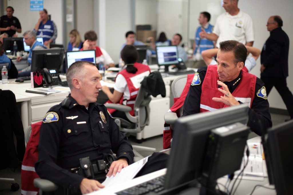 NBPD Lieutenant Tom Fischbacher (left) and NBPD Chief Jay Johnson talk strategy during the drill. 