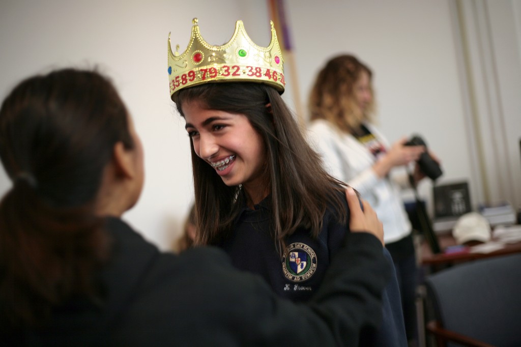 Karina Grover gets congratulated by friends, family and school staff after being crowned Pi Queen on campus.