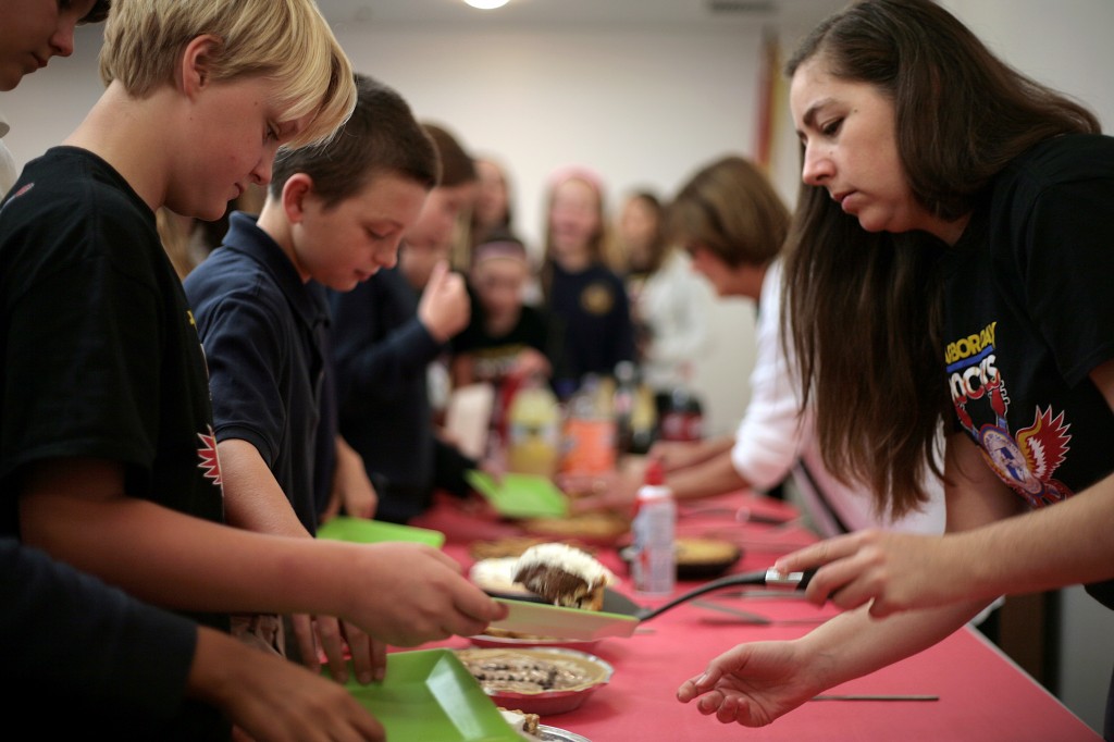 Harbor Day School math teacher Terra Shirvanian dishes out pie to students on March 14, National Pi Day.