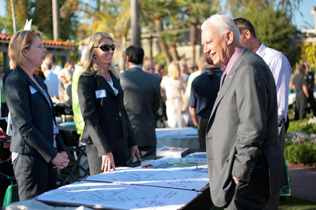 (right to left) Mayor Rush Hill speaks to deputy community development director  Brenda Wineski and city community development director Kim Brandt during the community expo portion of Corona del Mar Business Improvement District’s annual town meeting on Wednesday.