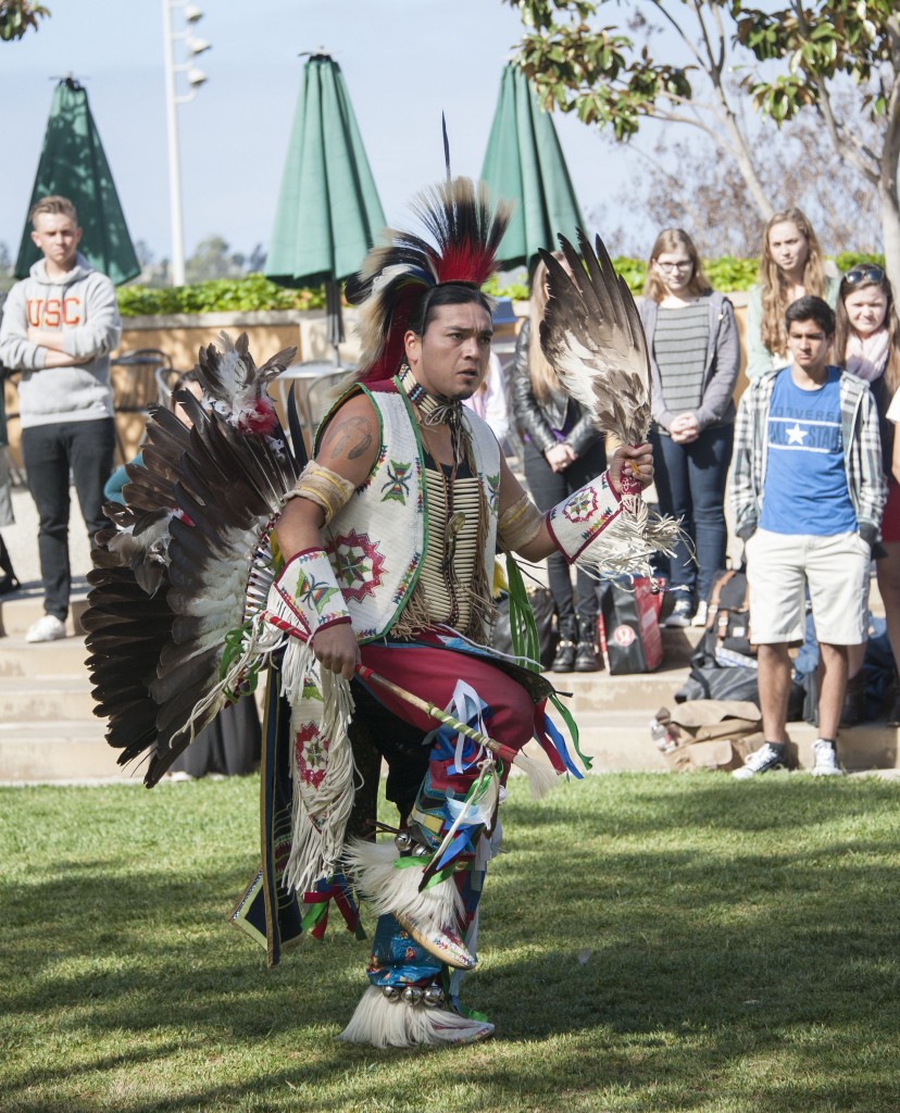 Pearson Tahuka-Nunez, 27, dances during the ceremony. His costume includes pieces from many different Native American tribes. — Photo by Charles Weinberg