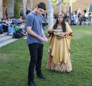 Jacque Tahuka-Nunez and student body president Jack Williamson place fresh sage leaves in a circle around the town square.  — Photo by Charles Weinberg