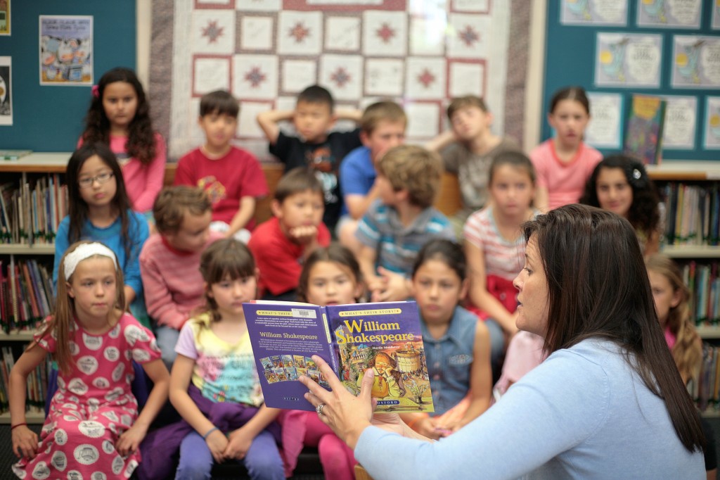 Pegasus School librarian Carin Meister reads a book about the life of William Shakespeare to a group of second graders on Wednesday. The school was celebrating the famous playwright’s 450th birthday this week.