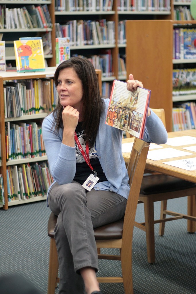 Meister reads a book about the life of William Shakespeare to a group of second graders on Wednesday.