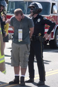 Ricker Hausam is “arrested” for driving under the influence as part of the staged drunk driving accident demonstration held Tuesday at CdM.