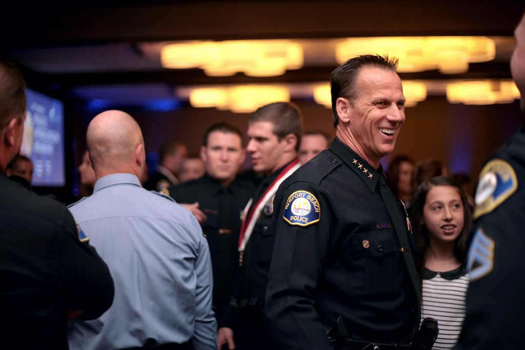 Now-retired Newport Beach Police Chief Jay Johnson chats with guests after an event in 2014. — Photo by Sara Hall ©