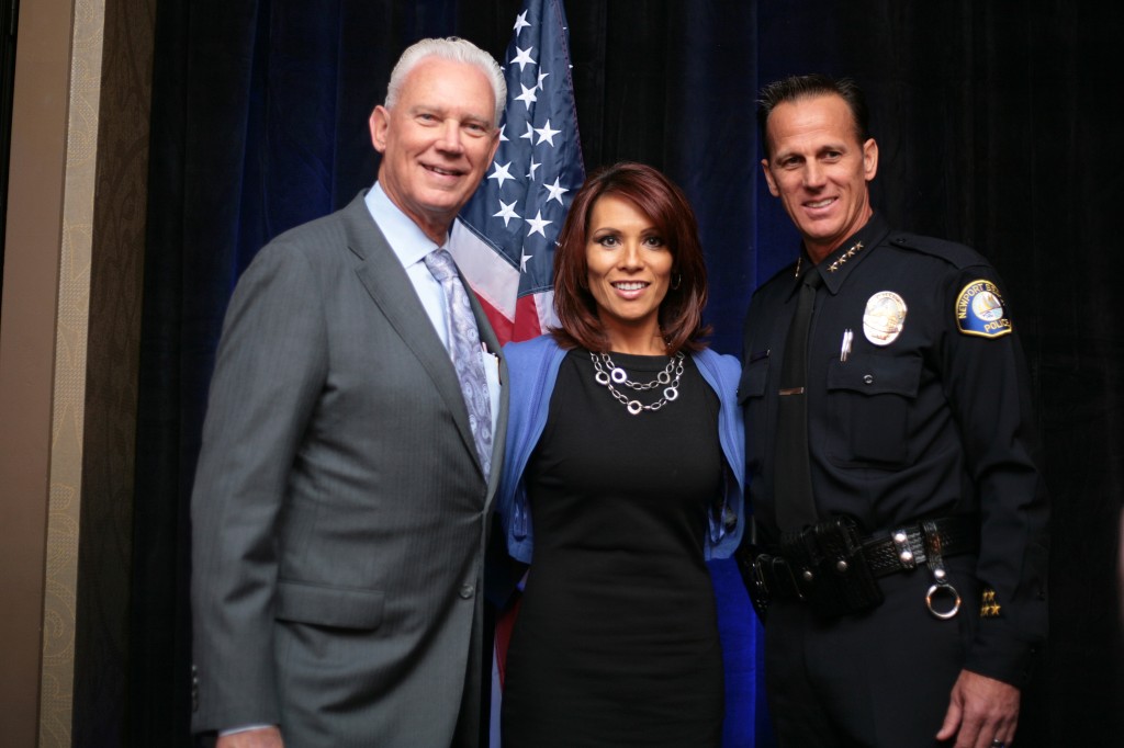 (left to right) Mayor Rush Hill, ABC7 OC Bureau Chief and event announcer Eileen Frere, and NBPD Chief Jay Johnson. — Photo by Sara Hall 