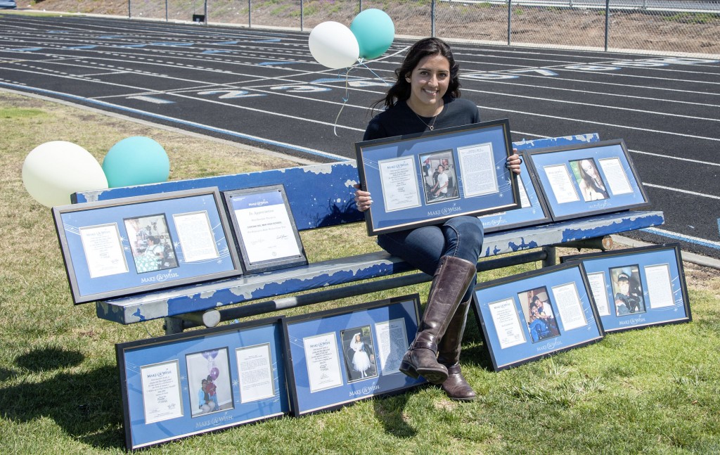 Club co-president Rafah Ali with the club’s plaques that display the wishes they’ve granted.  — All photos by Charles Weinberg © 