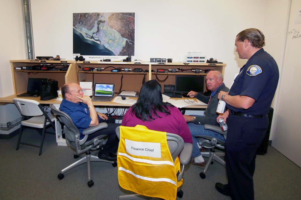 NBFD life safety specialist and CERT program leader, Matt Brisbois (right), talks with volunteers at the city’s Emergency Operations Center during the drill on Saturday.