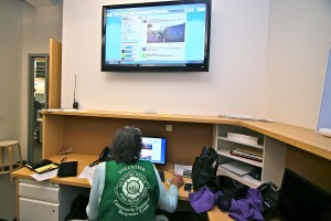 CERT volunteer Karen Tringali checks the Twitter feed for status updates in the volunteer room at the city EOC during Saturday’s drill.