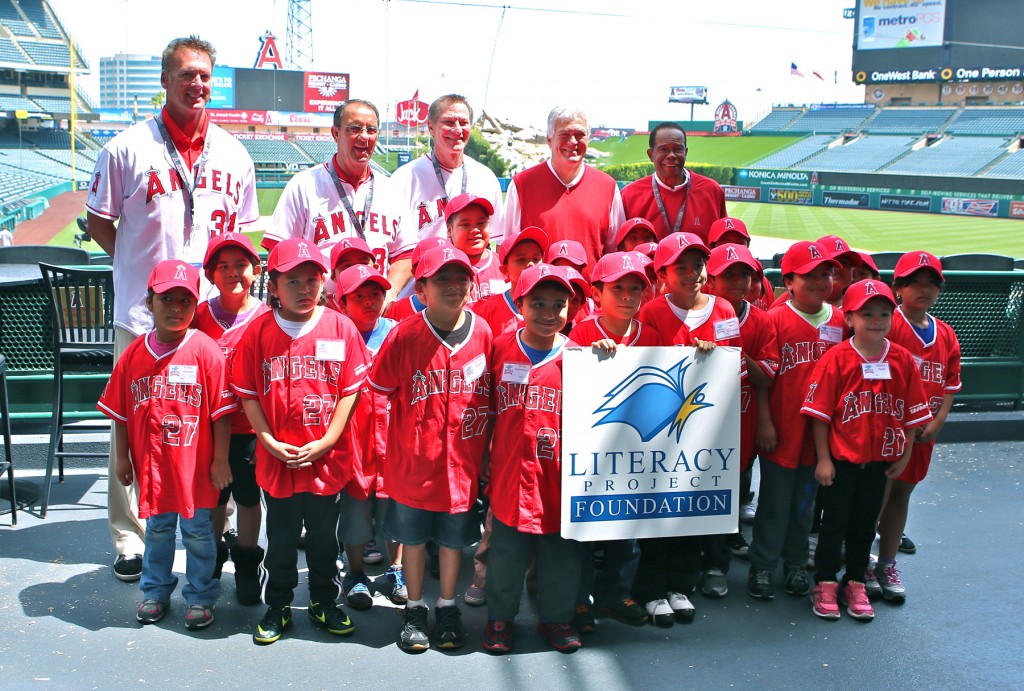 L to R back row: Chuck Finley, Clyde Wright, Bobby Grich, Angels Baseball Chairman Dennis Kuhl, and Rod Carew pose with Anaheim school children as part of Angels Baseball Foundation’s “Readers in the Outfield” Literacy Day to benefit Newport Beach-based Literacy Project Foundation’s reading program.