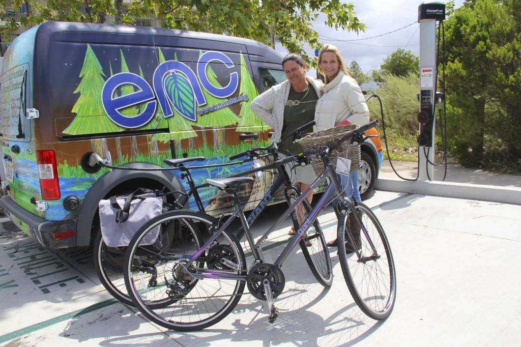 (left) Melody Robinson, a member of the Philanthropy Committee for the Newport Chapter of National Charity League, presents two donated giant escape hybrid bikes to Lori Whalen, Education & Community Relations Director of Environmental Nature Center in Newport Beach. — Photo courtesy National Charity League ©