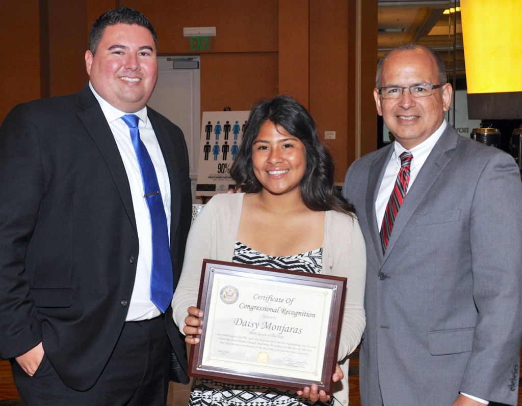 Robert Santana, CEO of the Boys & Girls Club of Santa Ana, Daisy Monjaras, the club’s 2014 Youth of the Year, and Gus Castellanos, district director, 47th district, Loretta Sanchez office.