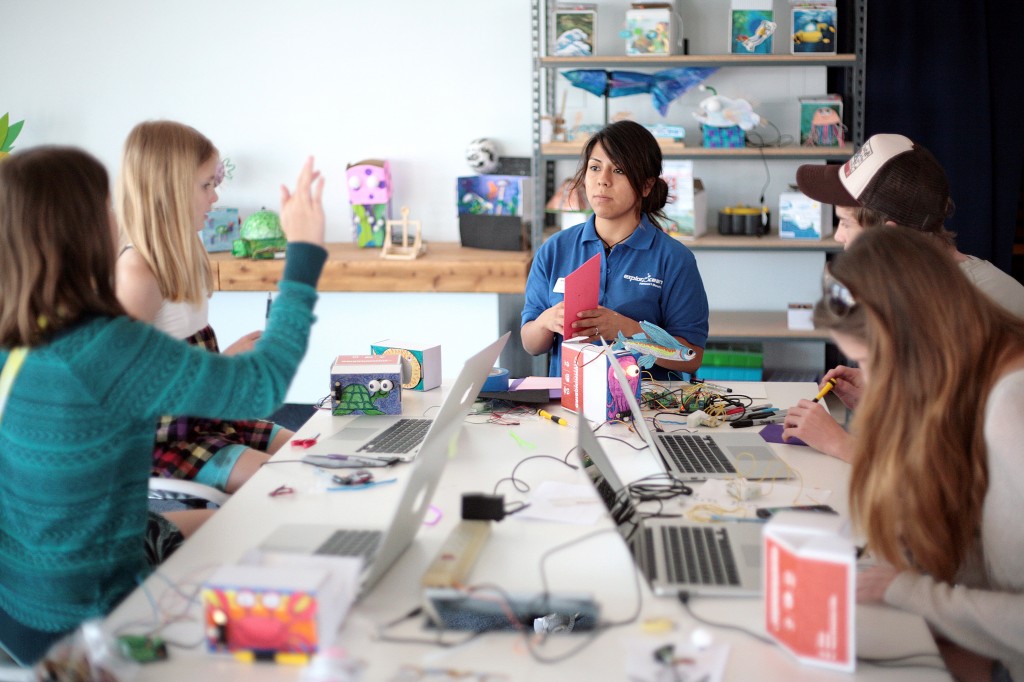 A group of Huntington Beach siblings, between ages 10 and 18, work on their Hummingbird robotic kits at an ExplorOcean workshop on Tuesday.