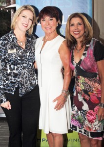 Impact Giving Partners Deborah Anderson of Corona del Mar (center) and Loreen Gilbert of Laguna Beach (right) congratulate a representative from Women Helping Women (left).