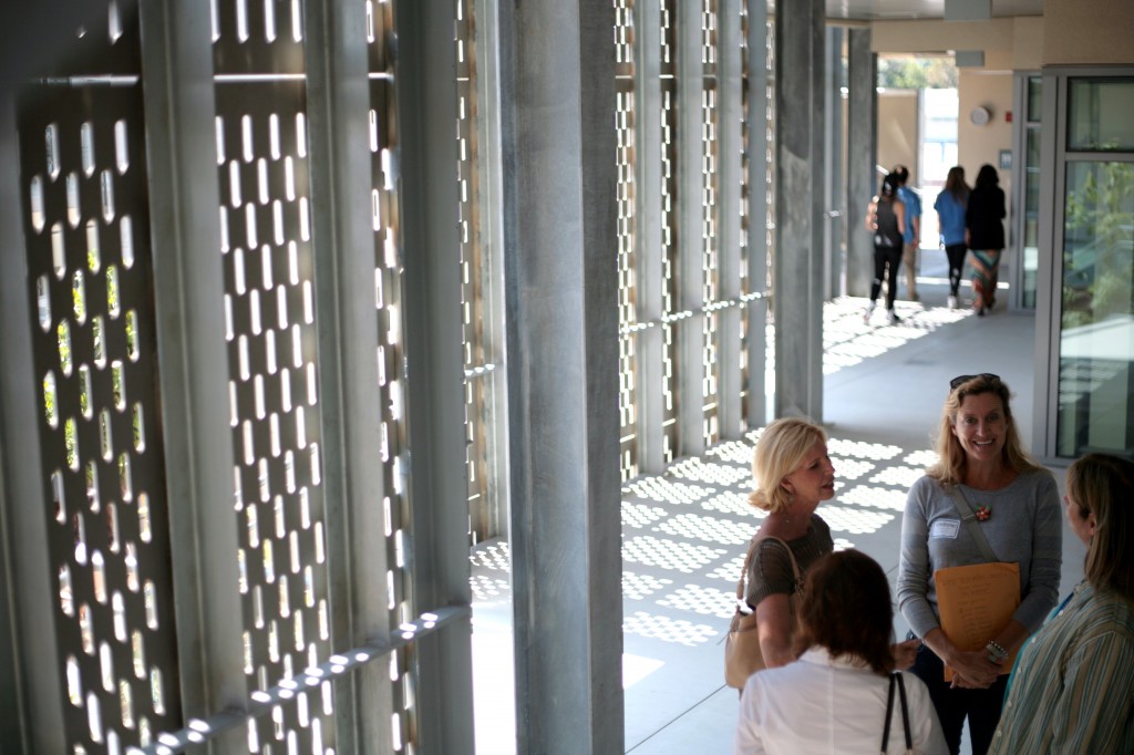 Visitors chat in one of the hallways at the enclave.