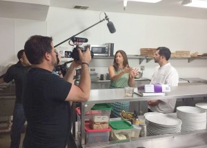 Carrie Williams films a segment of “Dine Newport Beach.” 