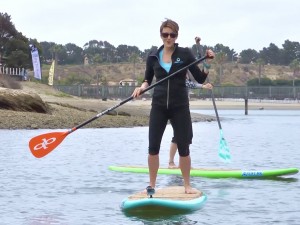 Kelly Lam, host of NBTV's "Active Me" demonstrates paddle boarding in the Upper Back Bay.