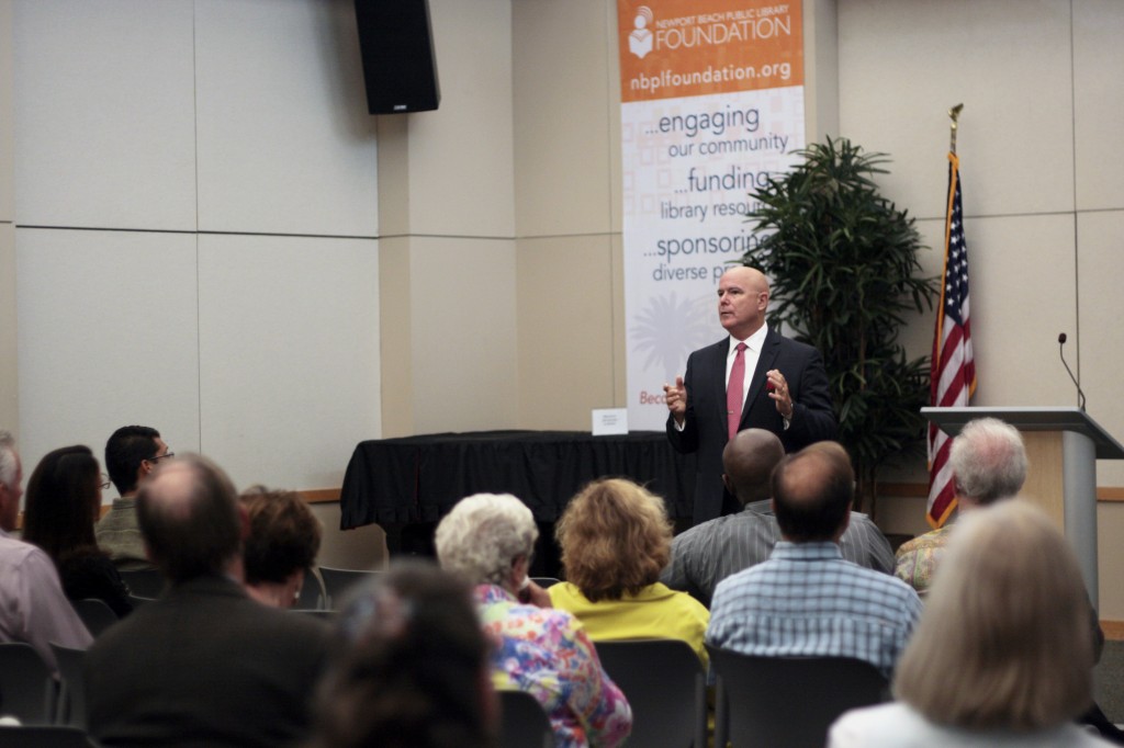 The audience listens to Giancola talk about OC issues.