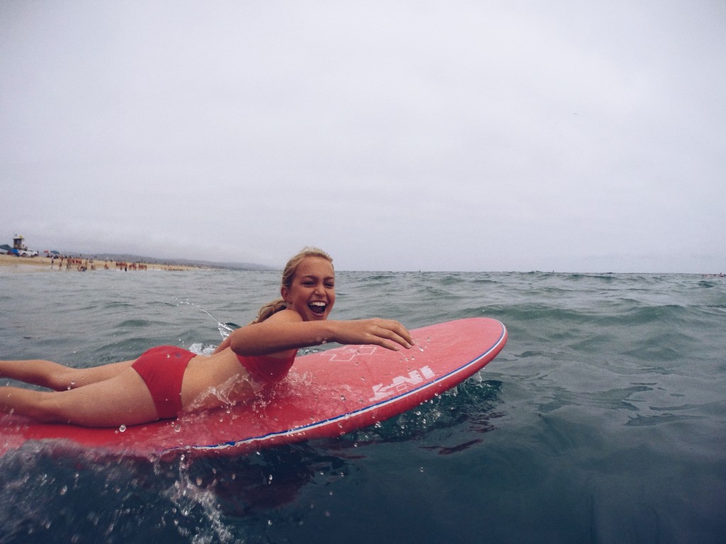 A junior lifeguard paddles out during the summer 2014 class.