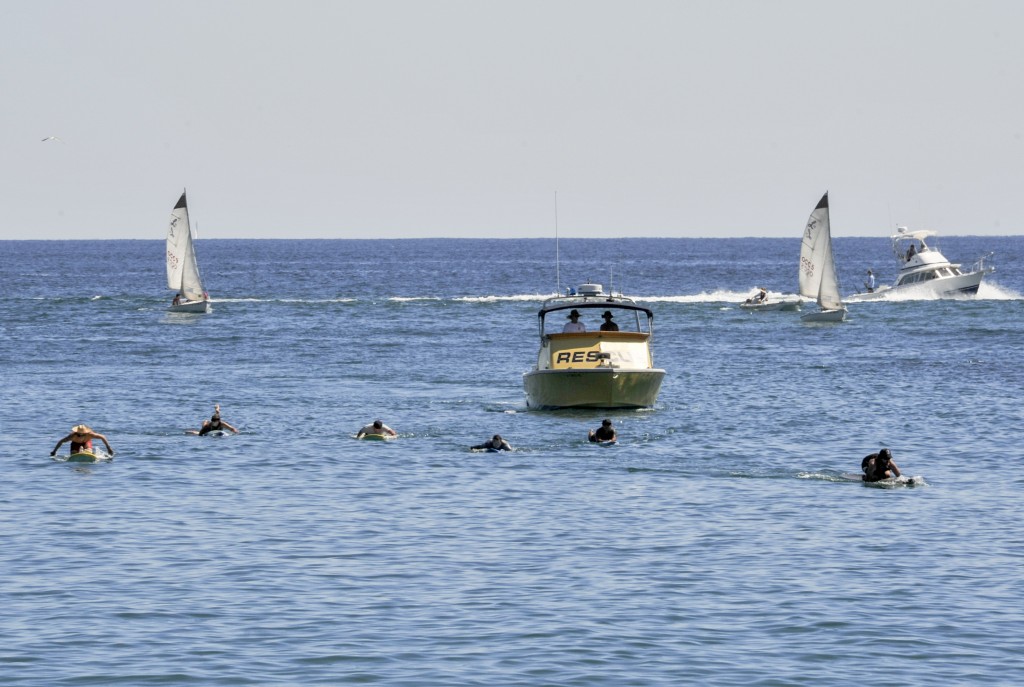 Newport Beach Lifeguards participate in relay paddle for John Wayne Cancer Foundation. — Photo by Lawrence Sherwin ©