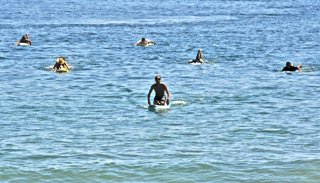 Newport Beach Lifeguards participate in relay paddle for John Wayne Cancer Foundation. — Photo by Lawrence Sherwin ©