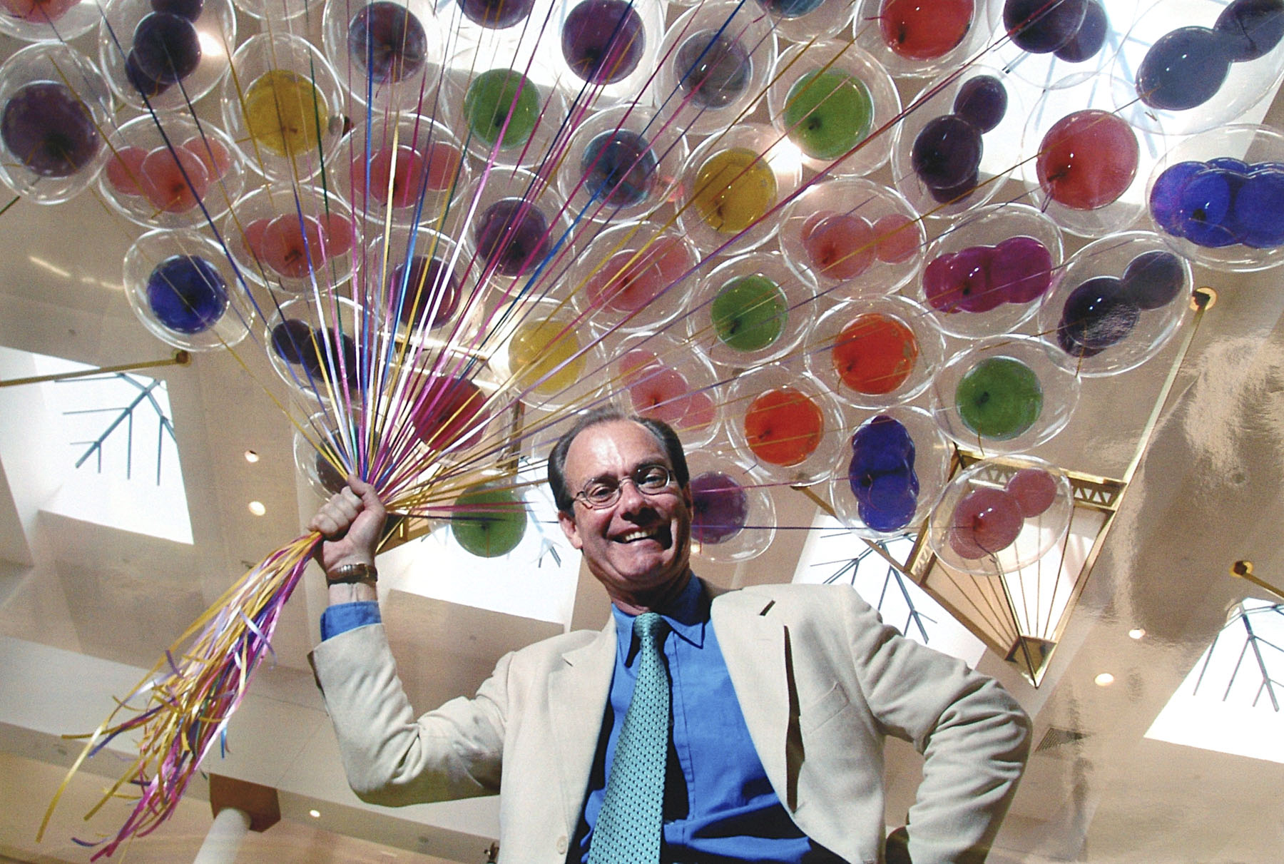 Treb Heining and a handful of colorful balloons. — Photo courtesy Treb Heining ©