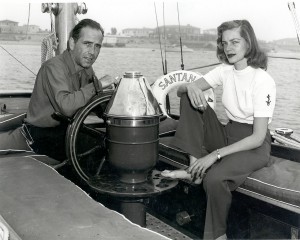 Humphrey Bogart and Lauren Bacall aboard their boat, Santana, in Newport Harbor